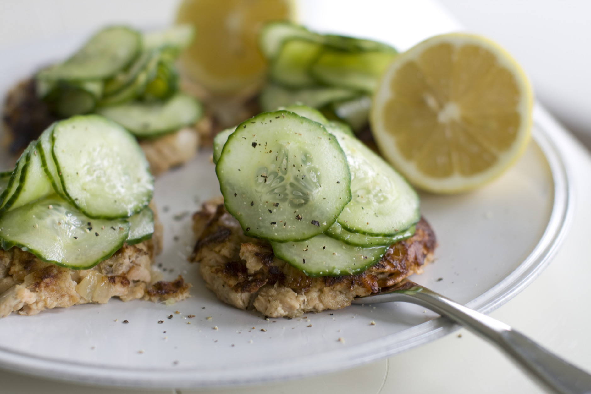 This July 22, 2013 photo shows wasabi-spiked salmon cakes with pickled cucumber in Concord, N.H. (AP Photo/Matthew Mead)
