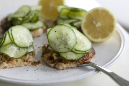 This July 22, 2013 photo shows wasabi-spiked salmon cakes with pickled cucumber in Concord, N.H. (AP Photo/Matthew Mead)