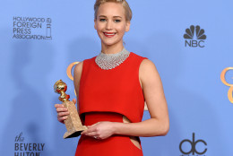 Jennifer Lawrence poses in the press room with the award for best performance by an actress in a motion picture - musical or comedy for Joy at the 73rd annual Golden Globe Awards on Sunday, Jan. 10, 2016, at the Beverly Hilton Hotel in Beverly Hills, Calif. (Photo by Jordan Strauss/Invision/AP)