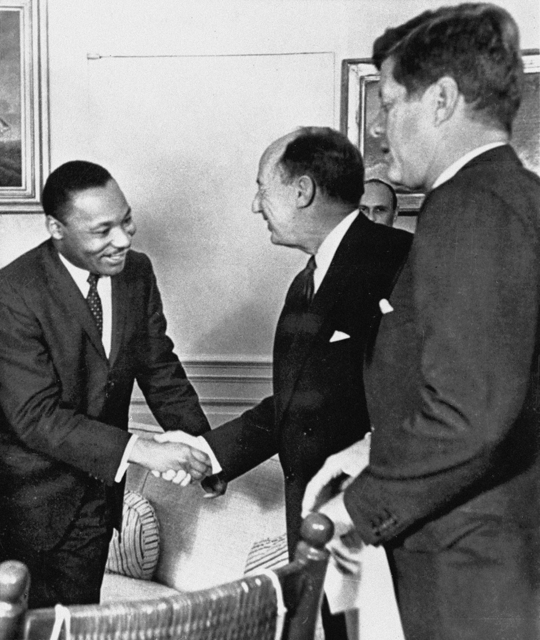 Ambassador Adlai Stevenson, the U.S. delegate to the United Nations, shakes hands with Martin Luther King Jr., president of the Southern Christian Leadership Conference, Atlanta, Ga., at the White House in Washington with President John F. Kennedy at right. The meeting occurred as Kennedy met with members of the American Negro Leadership Conference on Africa. Historians generally agree that Kennedy's phone call to Coretta Scott King expressing concern over her husband's arrest in October 1960, and Robert Kennedy's work behind the scenes to get King released, helped JFK win the White House that fall. King himself, while appreciative, wasn't as quick to credit the Kennedys alone with getting him out of jail, according to a previously unreleased portion of the interview with the civil rights leader days after Kennedy's election. (AP Photo, File)