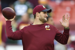 Washington Redskins quarterback Kirk Cousins (8) warms up before an NFL wild card playoff football game against the Green Bay Packers in Landover, Md., Sunday, Jan. 10, 2016. (AP Photo/Nick Wass)