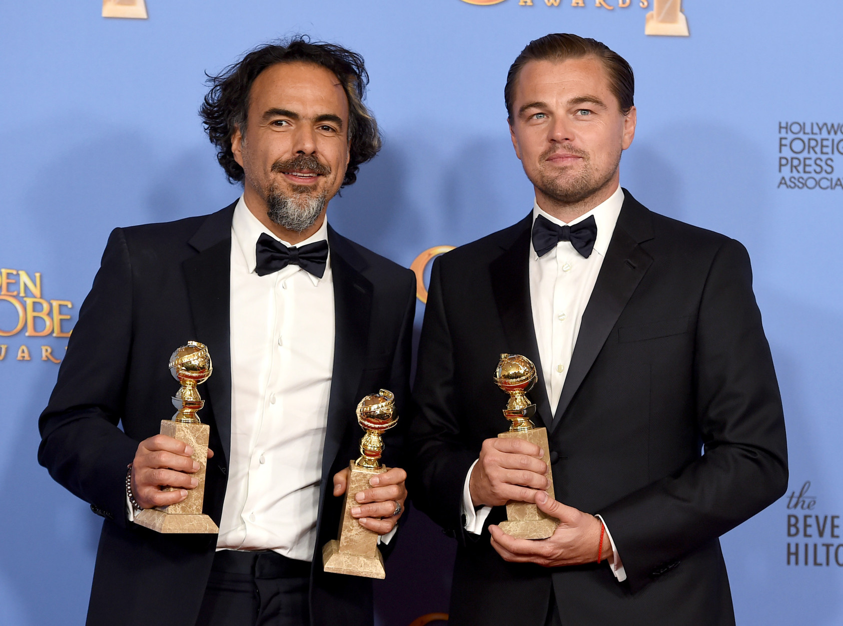 Alejandro Gonzalez Inarritu, left, and Leonardo DiCaprio pose in the press room with the award for best motion picture - drama for The Revenant at the 73rd annual Golden Globe Awards on Sunday, Jan. 10, 2016, at the Beverly Hilton Hotel in Beverly Hills, Calif. (Photo by Jordan Strauss/Invision/AP)