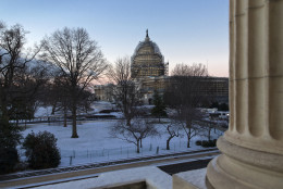 The Capitol in Washington, Thursday morning, Jan. 21, 2016, after less than an inch of overnight snow created hazardous road conditions and major traffic delays. The Washington region could get up to two feet of snow along with strong winds and whiteout conditions on Friday night and Saturday. (AP Photo/J. Scott Applewhite)