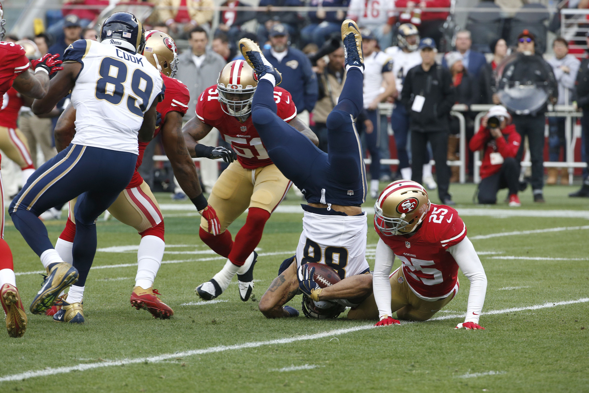St. Louis Rams tight end Lance Kendricks (88) is tackled by San Francisco 49ers strong safety Jimmie Ward (25) during the first half of an NFL football game in Santa Clara, Calif., Sunday, Jan. 3, 2016. (AP Photo/Tony Avelar)