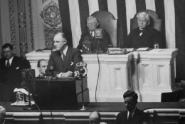President Franklin Roosevelt delivering his annual message on the State of the Union to a session of the Senate and House in the House chamber on Jan. 3, 1934 behind him (left to right) are Vice President John Garner and Speaker Henry Rainey. (AP Photo)