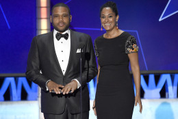Anthony Anderson, left, and Tracee Ellis Ross present the award for best movie made for television or limited series at the 21st annual Critics' Choice Awards at the Barker Hangar on Sunday, Jan. 17, 2016, in Santa Monica, Calif. (Photo by Chris Pizzello/Invision/AP)