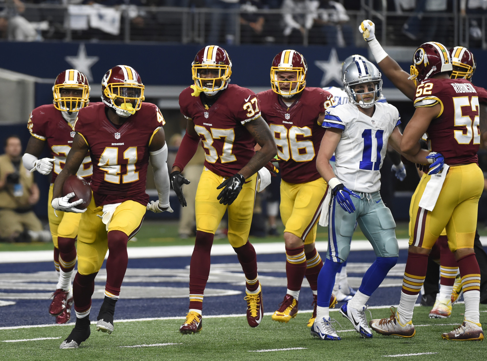 Washington Redskins' Will Blackmon (41) celebrates with Jeremy Harris (37), Houston Bates (96) and Keenan Robinson (52) after intercepting a pass intended for Dallas Cowboys wide receiver Cole Beasley (11) near the goal line in the second half of an NFL football game, Sunday, Jan. 3, 2016, in Arlington, Texas. (AP Photo/Michael Ainsworth)