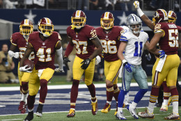 Washington Redskins' Will Blackmon (41) celebrates with Jeremy Harris (37), Houston Bates (96) and Keenan Robinson (52) after intercepting a pass intended for Dallas Cowboys wide receiver Cole Beasley (11) near the goal line in the second half of an NFL football game, Sunday, Jan. 3, 2016, in Arlington, Texas. (AP Photo/Michael Ainsworth)