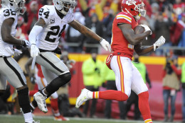 Kansas City Chiefs wide receiver Jeremy Maclin, right, runs for a touchdown past Oakland Raiders safety Charles Woodson (24) and cornerback TJ Carrie (38) during the first half of an NFL football game in Kansas City, Mo., Sunday, Jan. 3, 2016. (AP Photo/Ed Zurga)
