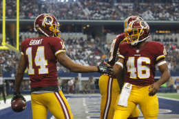 Washington Redskins' Ryan Grant (14) is congratulated by teammate Alfred Morris (46) after scoring a touchdown against the Dallas Cowboys in the first half of an NFL football game, Sunday, Jan. 3, 2016, in Arlington, Texas. (AP Photo/Michael Ainsworth)
