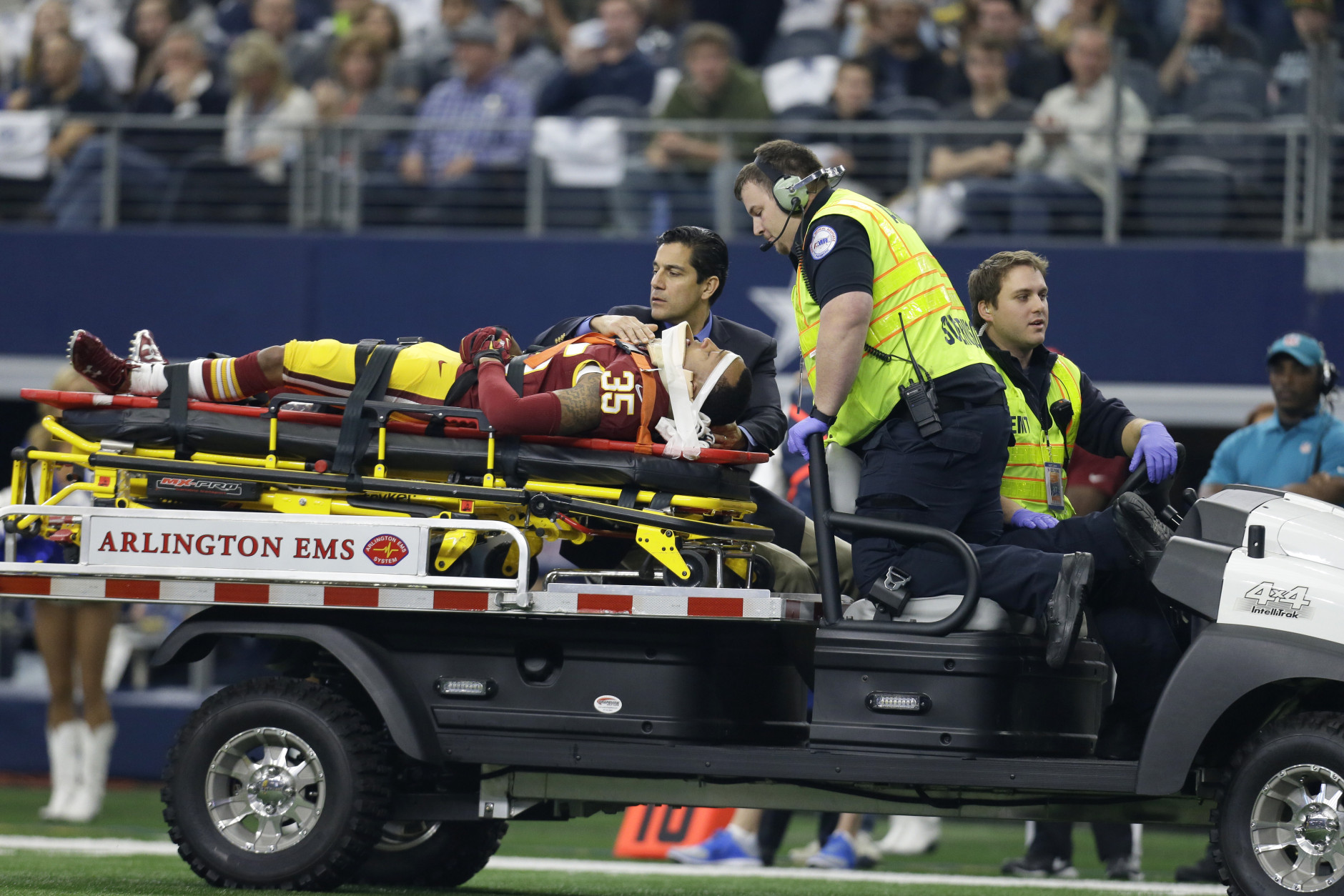 Washington Redskins defensive back Dashaun Phillips (35) is carted off the field by emergency personnel after suffering an unknown injury in the first half of an NFL football game against the Dallas Cowboys, Sunday, Jan. 3, 2016, in Arlington, Texas. (AP Photo/Tim Sharp)