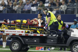 Washington Redskins defensive back Dashaun Phillips (35) is carted off the field by emergency personnel after suffering an unknown injury in the first half of an NFL football game against the Dallas Cowboys, Sunday, Jan. 3, 2016, in Arlington, Texas. (AP Photo/Tim Sharp)