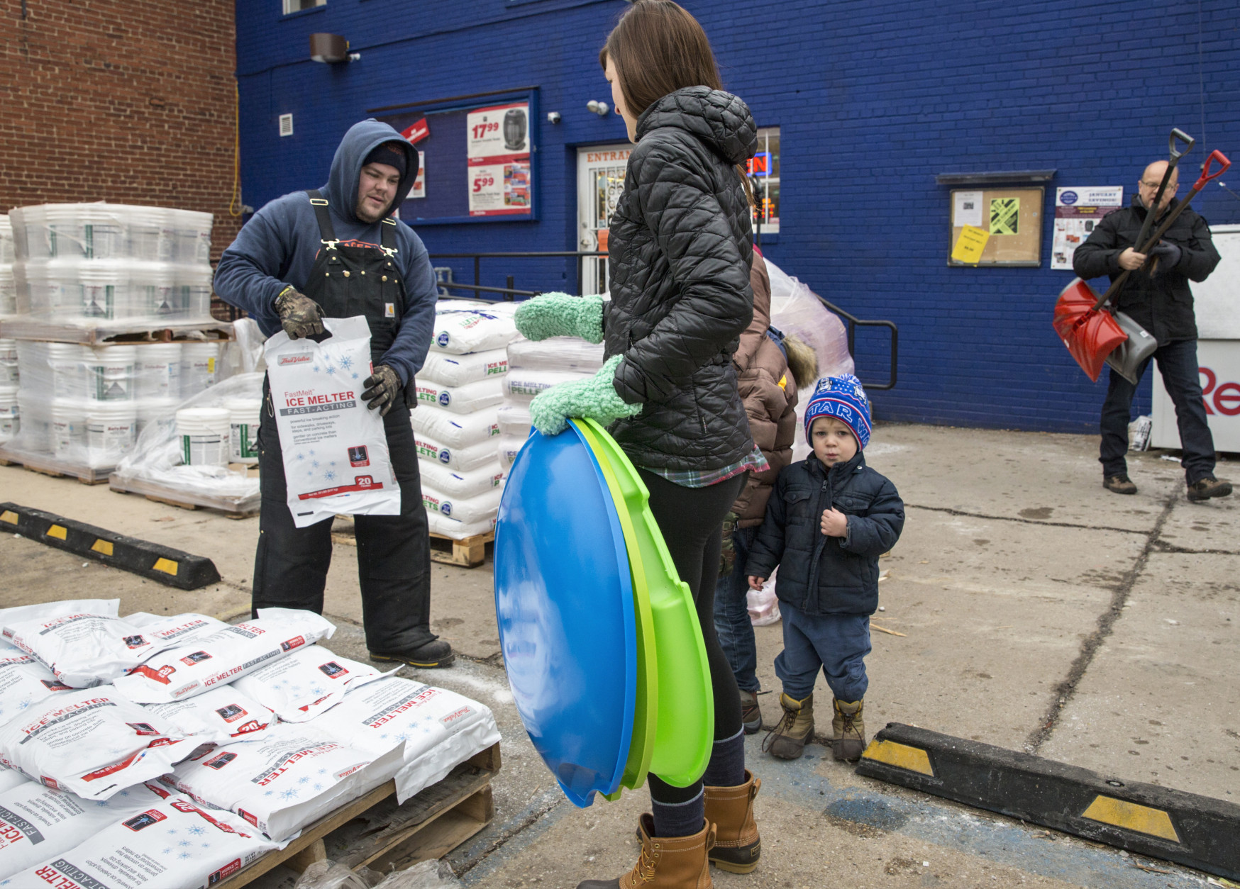 Residents of the Capitol Hill neighborhood in Washington flock to Frager's Hardware, Friday, Jan. 22, 2016, to prepare for the anticipated blizzard that's heading for the Eastern U.S. and threatening the District of Columbia with two feet of snow.  (AP Photo/J. Scott Applewhite)