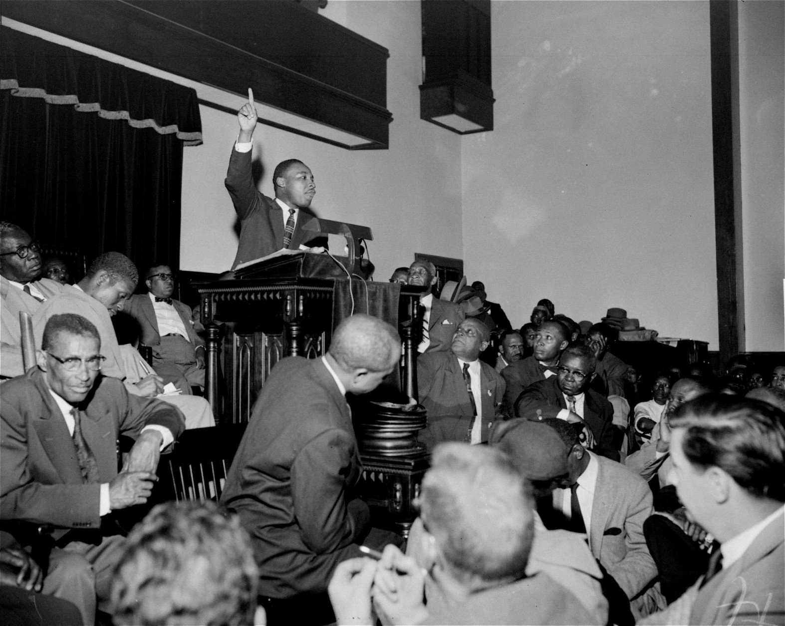 The Rev. Martin Luther King, Jr. is shown speaking to an overflow crowd at a mass meeting at the Holt Street Baptist Church.  King, leader of the mass bus boycott, was found guilty March 22, 1956 of conspiracy in the Montgomery bus boycott. He was fined $500.  King said the boycott of city buses will continue "no matter how many times they convict me."   (AP Photo/Gene Herrick)