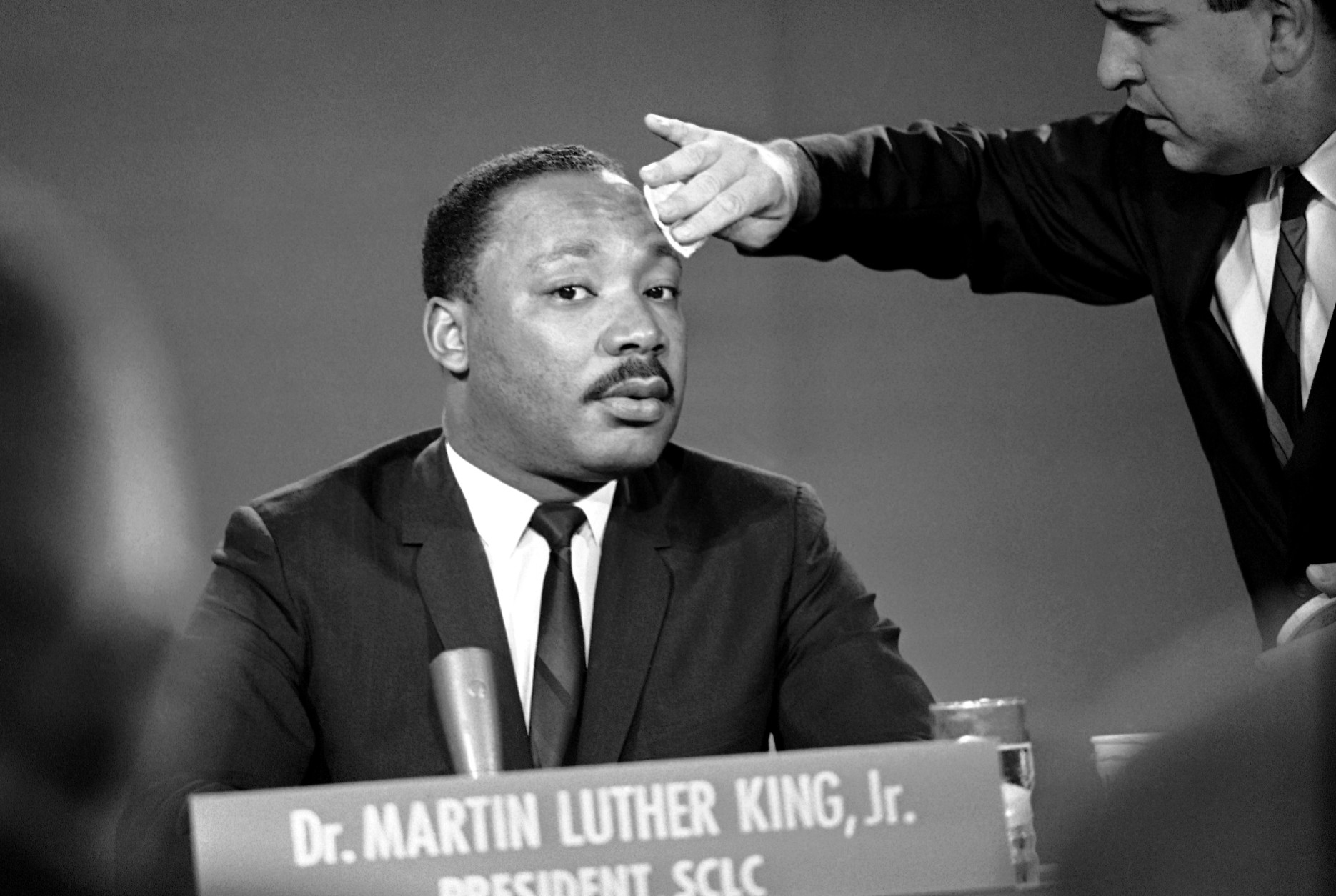 A makeup man puts a little powder on Martin Luther King's brow before a television program in Washington, Aug. 13, 1957. The president of the Southern Christian Leadership Conference discussed the current racial situation on NBC's "Meet the Press" program. (AP Photo/Henry Burroughs)