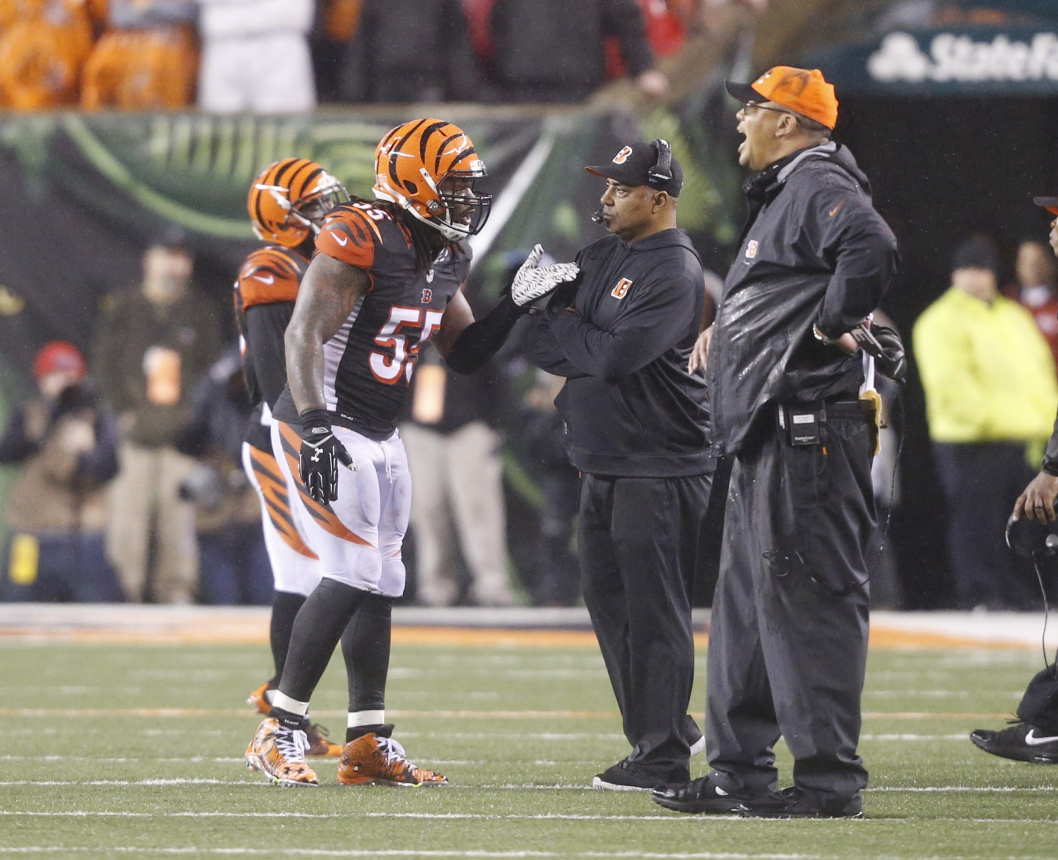 Cincinnati Bengals head coach Marvin Lewis talks with outside linebacker Vontaze Burfict (55) after a penalty during the second half of an NFL wild-card playoff football game Sunday, Jan. 10, 2016, in Cincinnati. Pittsburgh won 18-16. (AP Photo/Frank Victores)