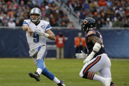 Detroit Lions quarterback Matthew Stafford (9) throws under pressure during the first half of an NFL football game against the Chicago Bears, Sunday, Jan. 3, 2016, in Chicago. (AP Photo/Nam Y. Huh)