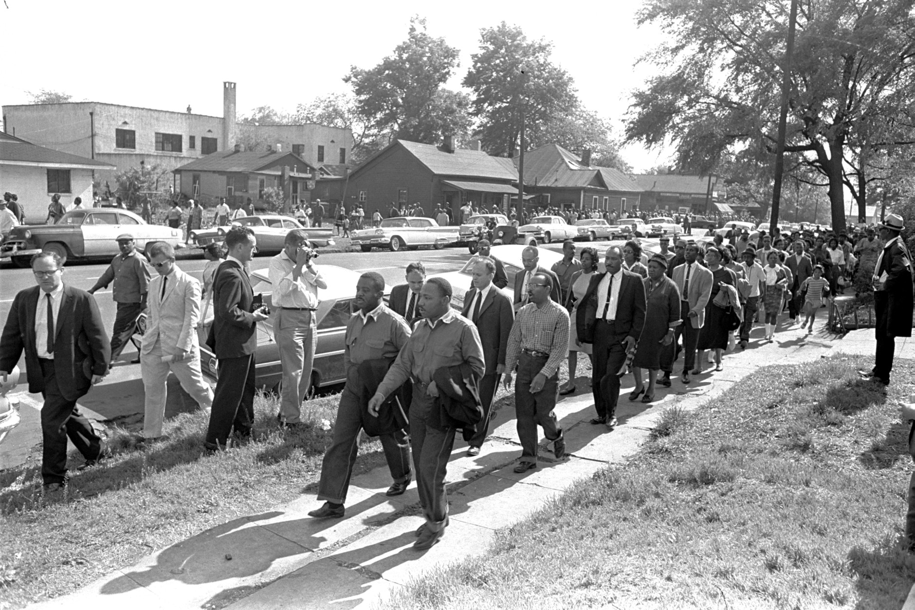 Rev. Ralph Abernathy, left, and Rev. Martin Luther King Jr. lead a column of demonstrators as they attempt to march on Birmingham, Ala., city hall April 12, 1963.  Police intercepted the group short of their goal. (AP Photo/Horace Cort)