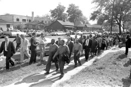 Rev. Ralph Abernathy, left, and Rev. Martin Luther King Jr. lead a column of demonstrators as they attempt to march on Birmingham, Ala., city hall April 12, 1963.  Police intercepted the group short of their goal. (AP Photo/Horace Cort)