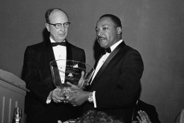 Civil rights leader Dr. Martin Luther King Jr., right, winner of the 1964 Nobel Peace Prize, receives a glass bowl inscribed to him as a "Citizen of Atlanta, with respect and admiration," from Rabbi Jacob Rothschild of the Temple Synagogue in Atlanta, Jan. 28, 1965. The award was presented at a banquet sponsored by Atlanta citizens in honor of King's receiving the Nobel Prize. (AP Photo)