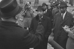 Wilson Baker, left, Selma, Alabama director of public safety, holds up his hand in front of Dr. Martin Luther King, jr., Feb. 1, 1965 to tell him that he and his followers, about 250 of them, were under arrest for parading without a permit. (AP Photo/Bill Hudson)