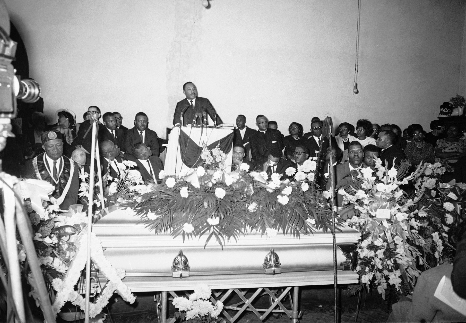 Dr. Martin Luther King Jr., as he preaches the funeral in Marion, Alabama on March, 1965 of Jimmy Lee Jackson, slain during a racial demonstration. King later led mourners three miles in the rain to a cemetery for burial. (AP Photo)