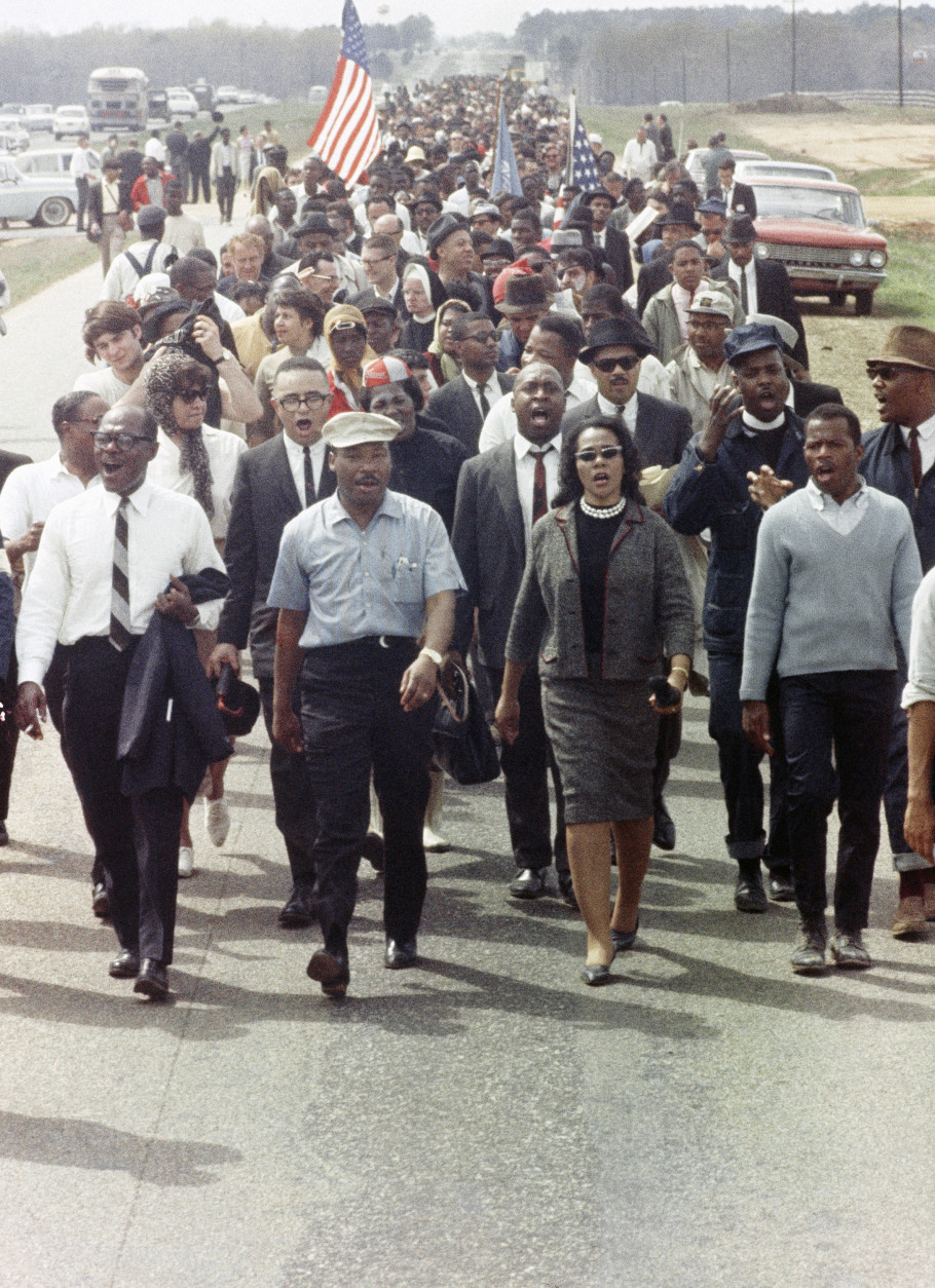 Rev. Martin Luther King with his wife Coretta  participate in march from Montgomery, Ala., to the state capitol on March 19, 1965. (AP Photo)