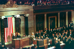 U.S. President Lyndon B. Johnson delivers the State of the Union address before the joint session of Congress in the House of Representatives in Washington D.C. on Jan. 12, 1966.  Seated behind the President are house speaker John McCormack, seated left, and Arizona Senator Carl Hayden (Dem).  (AP Photo)