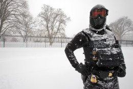 A uniformed U.S. Secret Service police officer stands guard in a knee-deep snow outside the White House in Washington, Saturday, Jan. 23, 2016.   (AP Photo/Manuel Balce Ceneta)