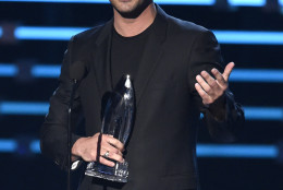 Taylor Kinney accepts the award for favorite dramatic TV actor for Chicago Fire at the People's Choice Awards at the Microsoft Theater on Wednesday, Jan. 6, 2016, in Los Angeles. (Photo by Chris Pizzello/Invision/AP)