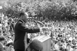 A large portion of the estimated 5,000 who listened intently to Dr. Martin Luther King, arrow, lower right, from Sproul Hall, University of California administration building in Berkeley, California, May 17, 1967. Dr. King reiterated his stand for non-violence and urged that young people support a peace bloc that would influence the 1968 elections. (AP Photo)