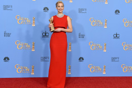 Jennifer Lawrence poses in the press room with the award for best performance by an actress in a motion picture - musical or comedy for Joy at the 73rd annual Golden Globe Awards on Sunday, Jan. 10, 2016, at the Beverly Hilton Hotel in Beverly Hills, Calif. (Photo by Jordan Strauss/Invision/AP)