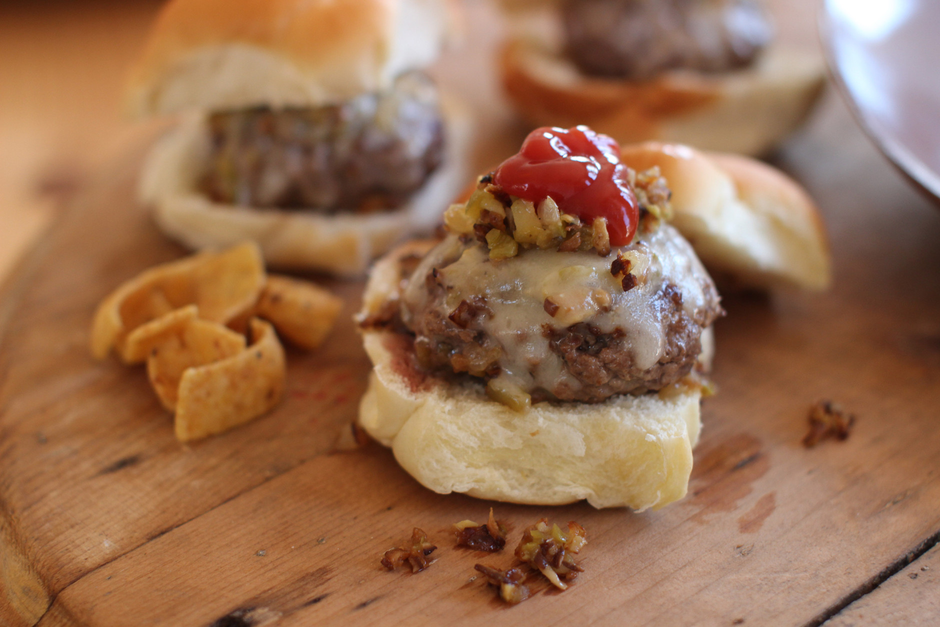 This Nov. 16, 2015 photo shows beer steamed cheese and mushroom beef sliders in Concord, N.H. This dish is from a recipe by Sara Moulton. (AP Photo/Matthew Mead)