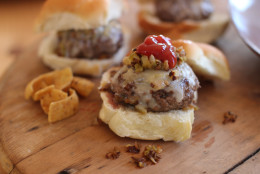 This Nov. 16, 2015 photo shows beer steamed cheese and mushroom beef sliders in Concord, N.H. This dish is from a recipe by Sara Moulton. (AP Photo/Matthew Mead)
