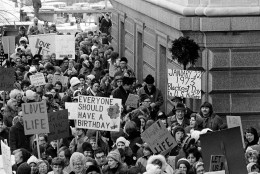 An estimated 5,000 people, women and men, march around the Minnesota Capitol building protesting the U.S. Supreme Court's Roe v. Wade decision, ruling against state laws that criminalize abortion, in St. Paul, Minn., Jan. 22, 1973.  The marchers formed a "ring of life" around the building.  (AP Photo)