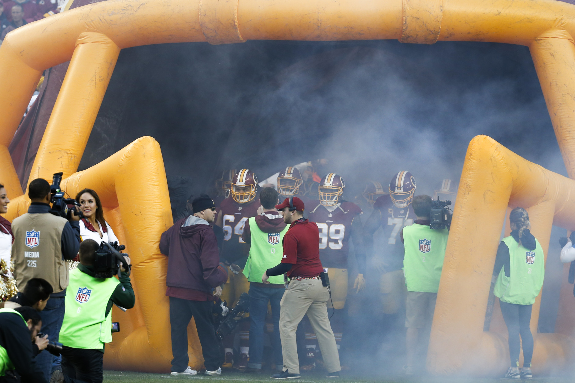 The Washington Redskins wait for their introduction before an NFL wild card playoff football game against the Green Bay Packers in Landover, Md., Sunday, Jan. 10, 2016. (AP Photo/Alex Brandon)