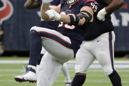 Houston Texans defensive end J.J. Watt (99) celebrates after he cause Jacksonville Jaguars quarterback Blake Bortles to fumble during the second half an NFL football game Sunday, Jan. 3, 2016, in Houston. The fumble was recovered by Houston Texans outside linebacker Whitney Mercilus. (AP Photo/David J. Phillip)
