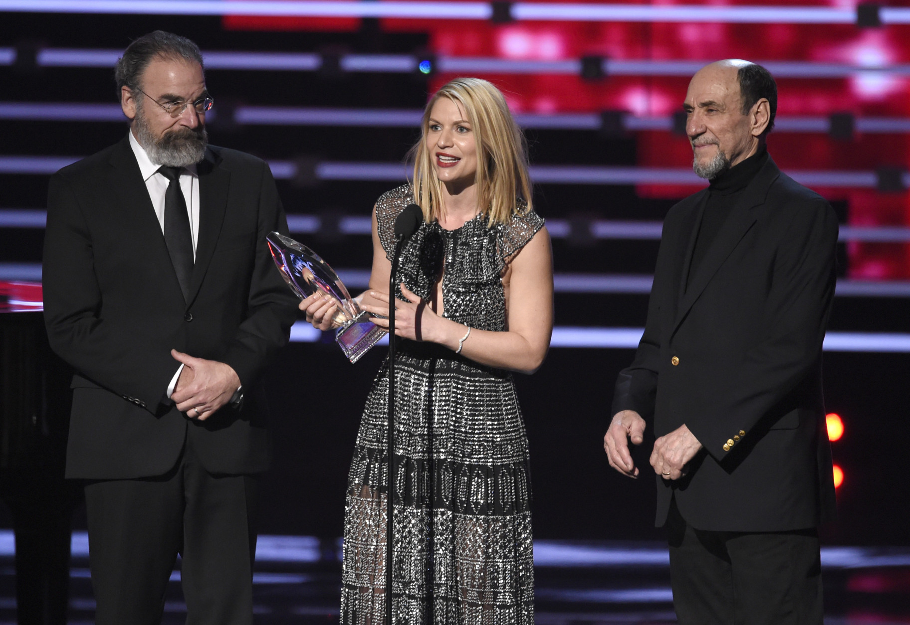 Mandy Patinkin, and from left, Claire Danes, and F. Murray Abraham accept the award for favorite premium cable tv show for Homeland at the People's Choice Awards at the Microsoft Theater on Wednesday, Jan. 6, 2016, in Los Angeles. (Photo by Chris Pizzello/Invision/AP)