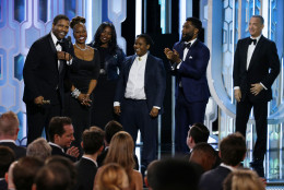 In this image released by NBC, Denzel Washington, left, stands with his wife Pauletta, second left, and his family as he accepts the Cecil B. Demille Award  at the 73rd Annual Golden Globe Awards at the Beverly Hilton Hotel in Beverly Hills, Calif., on Sunday, Jan. 10, 2016. (Paul Drinkwater/NBC via AP)