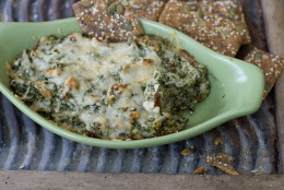 This Jan. 6, 2014 photo shows hot and spicy artichoke spinach dip in Concord, N.H. (AP Photo/Matthew Mead)