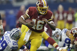 Washington Redskins running back Alfred Morris (46) carries the ball as Dallas Cowboys' Deji Olatoye (29) attempts the stop in the first half of an NFL football game, Sunday, Jan. 3, 2016, in Arlington, Texas. (AP Photo/Tim Sharp)