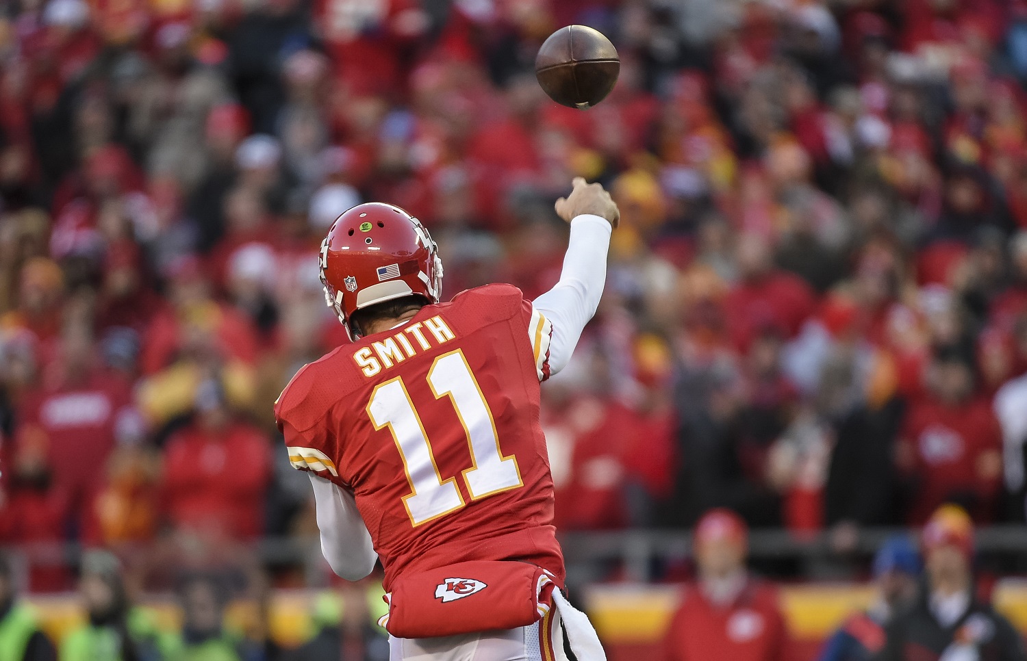 Kansas City Chiefs quarterback Alex Smith (11) throws against the Oakland Raiders during the first half of their NFL football game in Kansas City, Mo., Sunday, Jan, 3, 2016. (AP Photo/Reed Hoffmann)