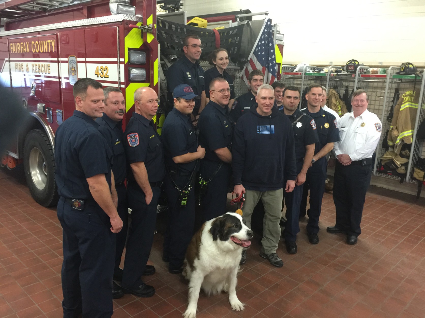  

Mark Wortman with his dog Milo's rescuers: Medics from Fairfax County Fire & Rescue Station 32 in Burke Centre, assisted Milo once he was freed from the pond. A crew from City of Fairfax Station 403 was the first to get into the water. The rescue squad from Burke Fire Station 14 was standing-by as back-up in case the water rescue team got into trouble or needed assistance. (WTOP/Kristi King)