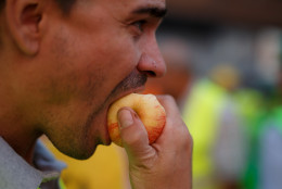 man eating apple