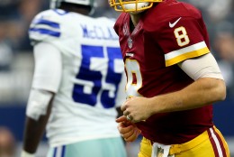 ARLINGTON, TX - JANUARY 03: Kirk Cousins #8 of the Washington Redskins reacts after throwing a touchdown pass against the Dallas Cowboys during the first quarter at AT&amp;T Stadium on January 3, 2016 in Arlington, Texas. (Photo by Ronald Martinez/Getty Images)
