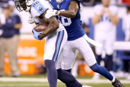 INDIANAPOLIS, IN - JANUARY 03:  Delanie Walker #82 of the Tennessee Titans is brought down by Greg Toler #28 of the Indianapolis Colts at Lucas Oil Stadium on January 3, 2016 in Indianapolis, Indiana.  (Photo by Andy Lyons/Getty Images)