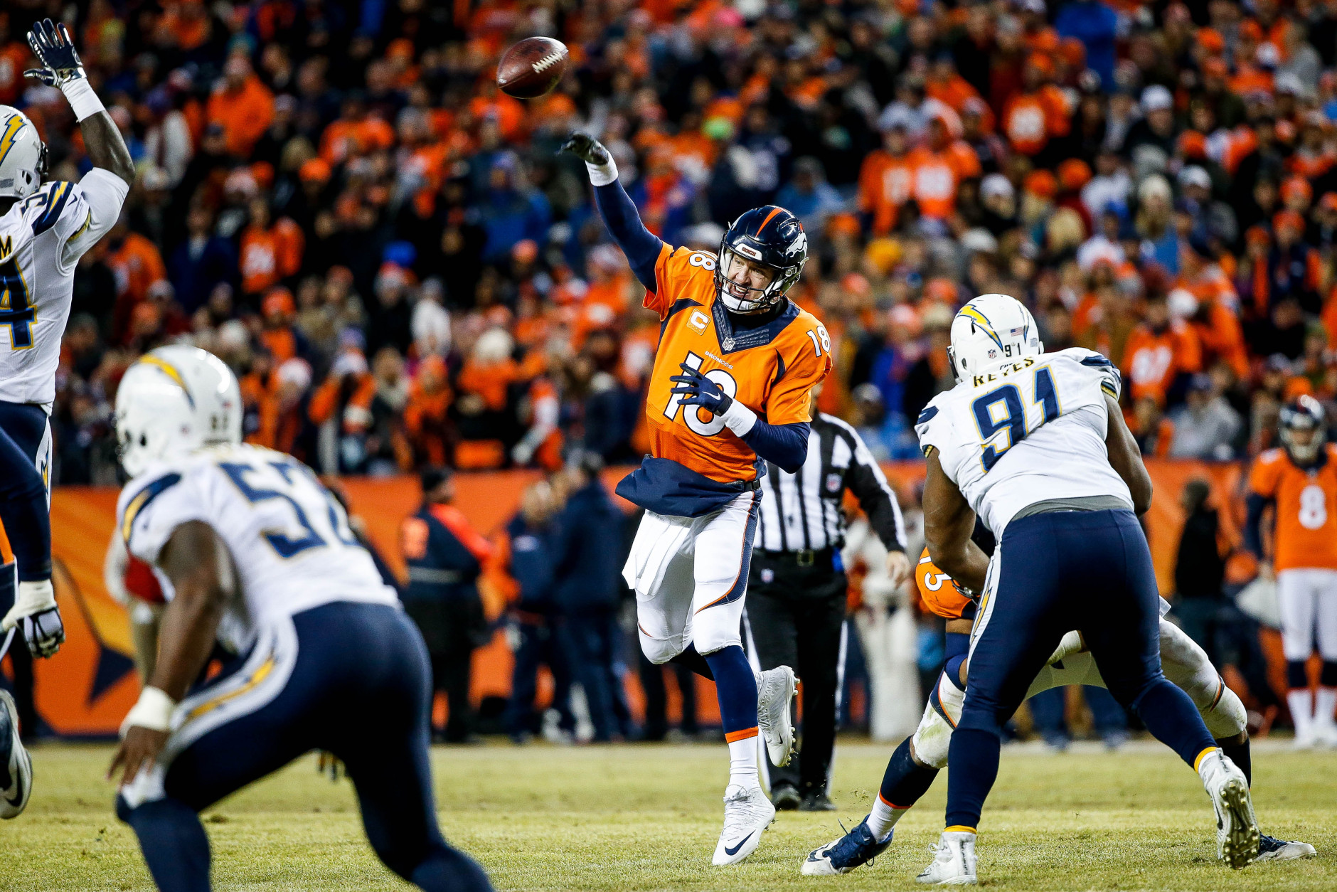 DENVER, CO - JANUARY 3:  Quarterback Peyton Manning #18 of the Denver Broncos passes against the San Diego Chargers during a game at Sports Authority Field at Mile High on January 3, 2016 in Denver, Colorado. (Photo by Sean M. Haffey/Getty Images)