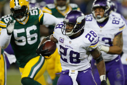 GREEN BAY, WI - JANUARY 03:  Adrian Peterson #28 of the Minnesota Vikings carries the ball during the fourth quarter against the Green Bay Packers at Lambeau Field on January 3, 2016 in Green Bay, Wisconsin.  (Photo by Wesley Hitt/Getty Images)