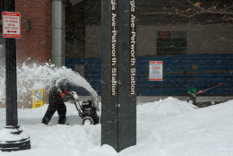 WASHINGTON, DC - JANUARY 23:  A man uses a snow blower to clear a sidewalk in front of the shuttered Georgia Ave.-Petworth metro station on January 23, 2016 in Washington, DC. Over a foot of snow has already fallen in the city in the past 24 hours, in what experts say could be a record-breaking storm.  (Photo by Allison Shelley/Getty Images)