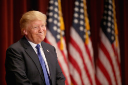 Republican presidential candidate Donald Trump smiles as he speaks to veterans at Drake University on January 28, 2016 in Des Moines, Iowa. Donald Trump held his alternative event to benefit veterans after withdrawing from the televised Fox News/Google GOP debate which airs at the same time. (Photo by Christopher Furlong/Getty Images)